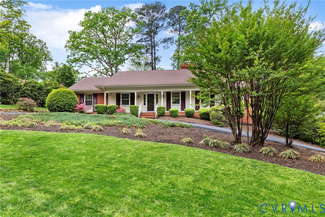 3140 Archdale Road Richmond, VA 23235 - Photo 3 of 48 a front view of a house with a yard
