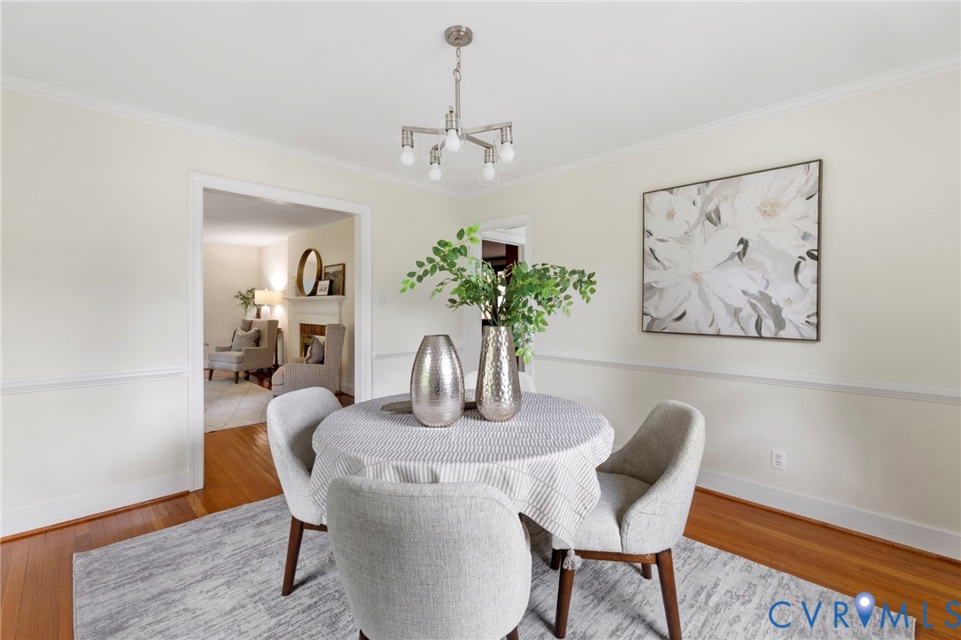 3140 Archdale Road Richmond, VA 23235 - Photo 9 of 48 a dining room with furniture and wooden floor