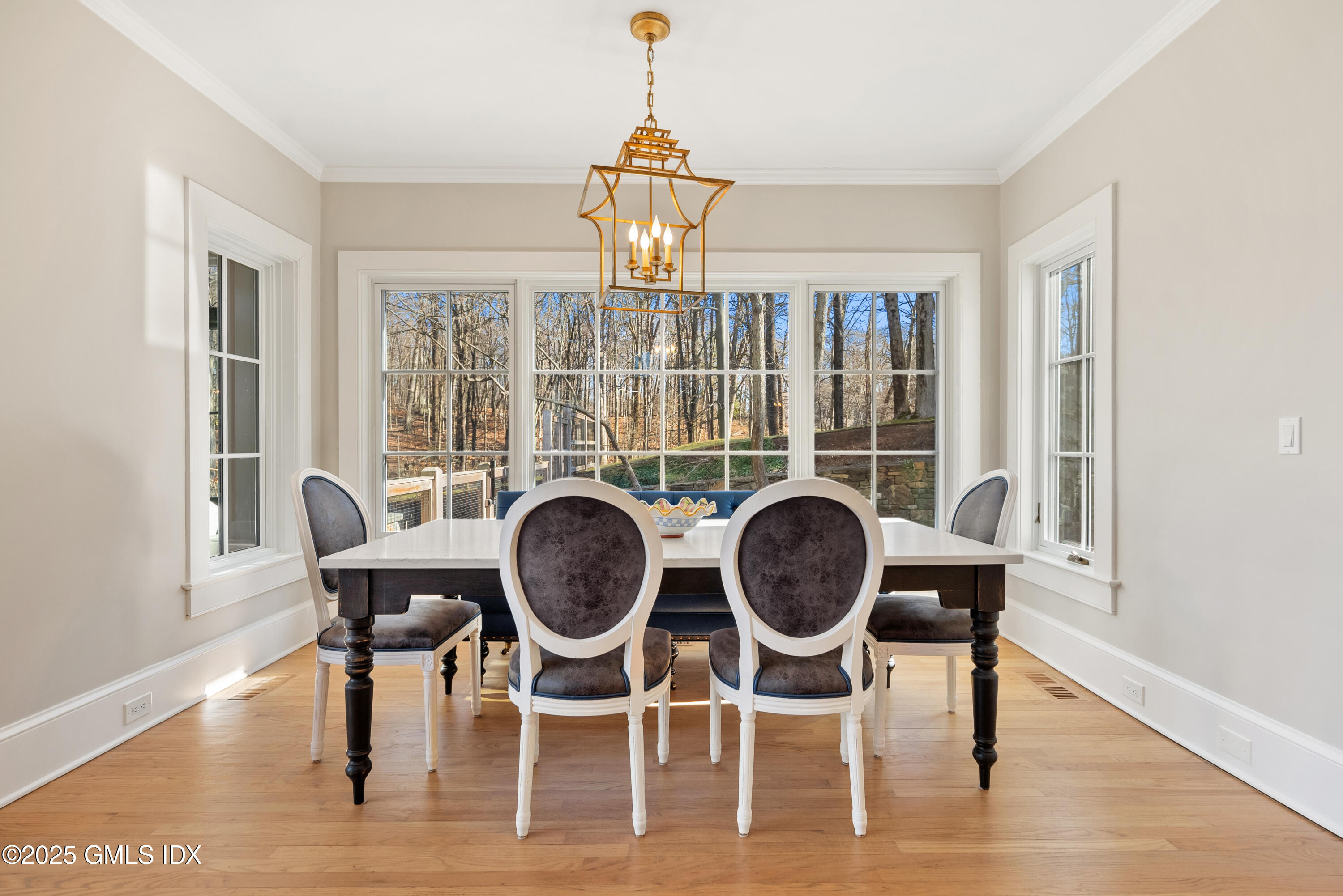 70 Sumner Road Greenwich, CT 06831 - Photo 20 of 57 a view of a dining room with furniture a rug and wooden floor