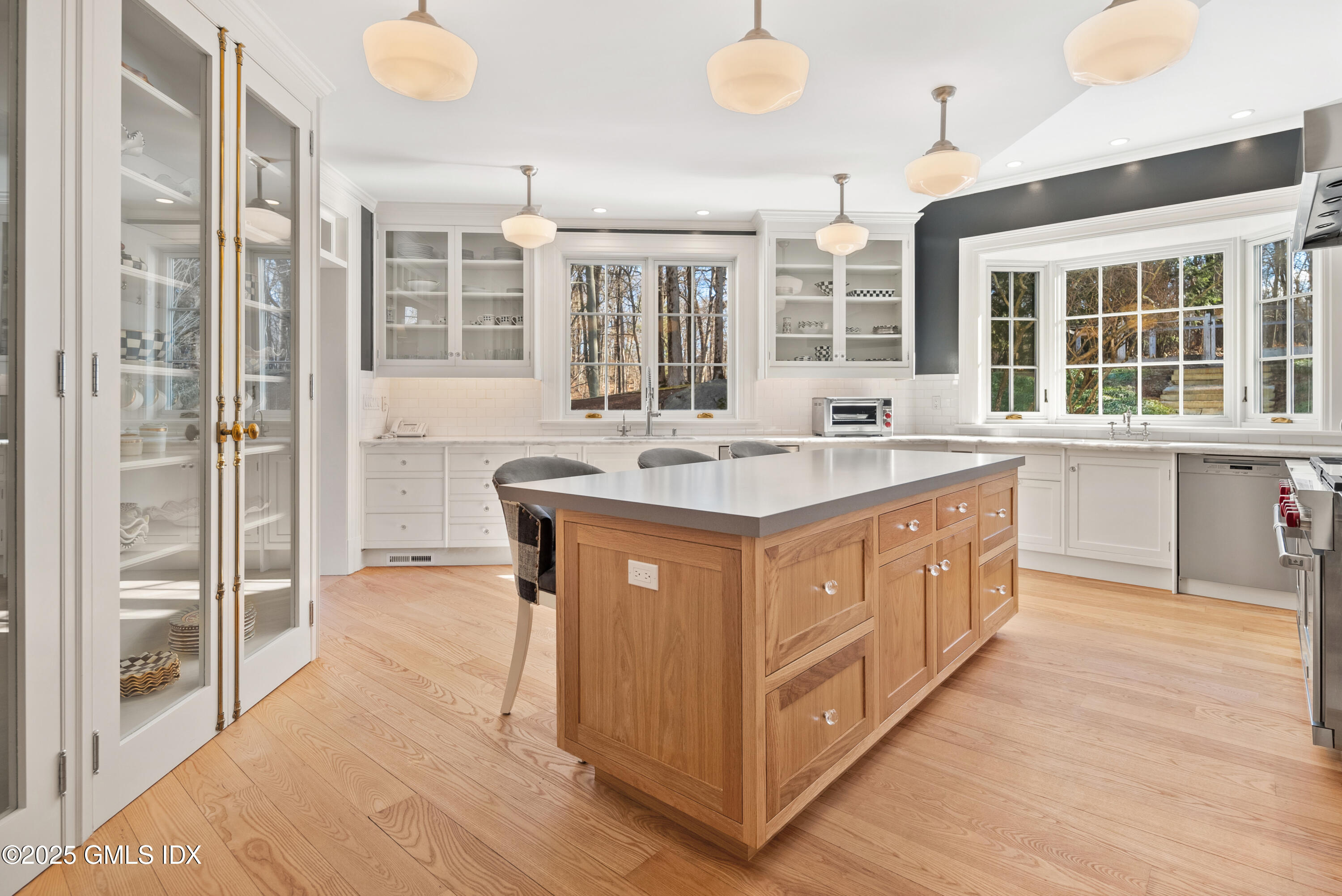70 Sumner Road Greenwich, CT 06831 - Photo 21 of 57 a kitchen with stainless steel appliances granite countertop a sink and a stove
