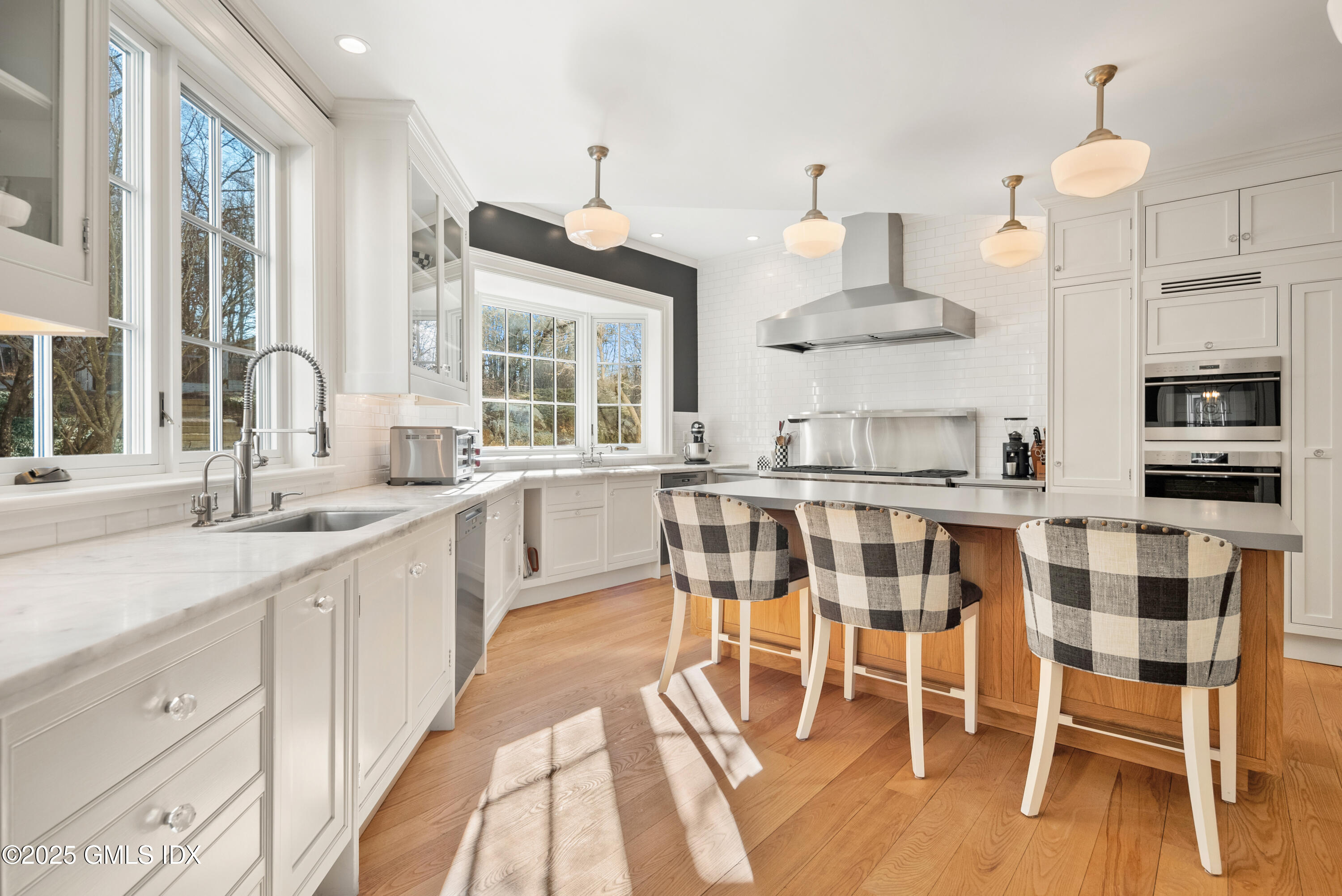 70 Sumner Road Greenwich, CT 06831 - Photo 23 of 57 a large kitchen with a table and chairs