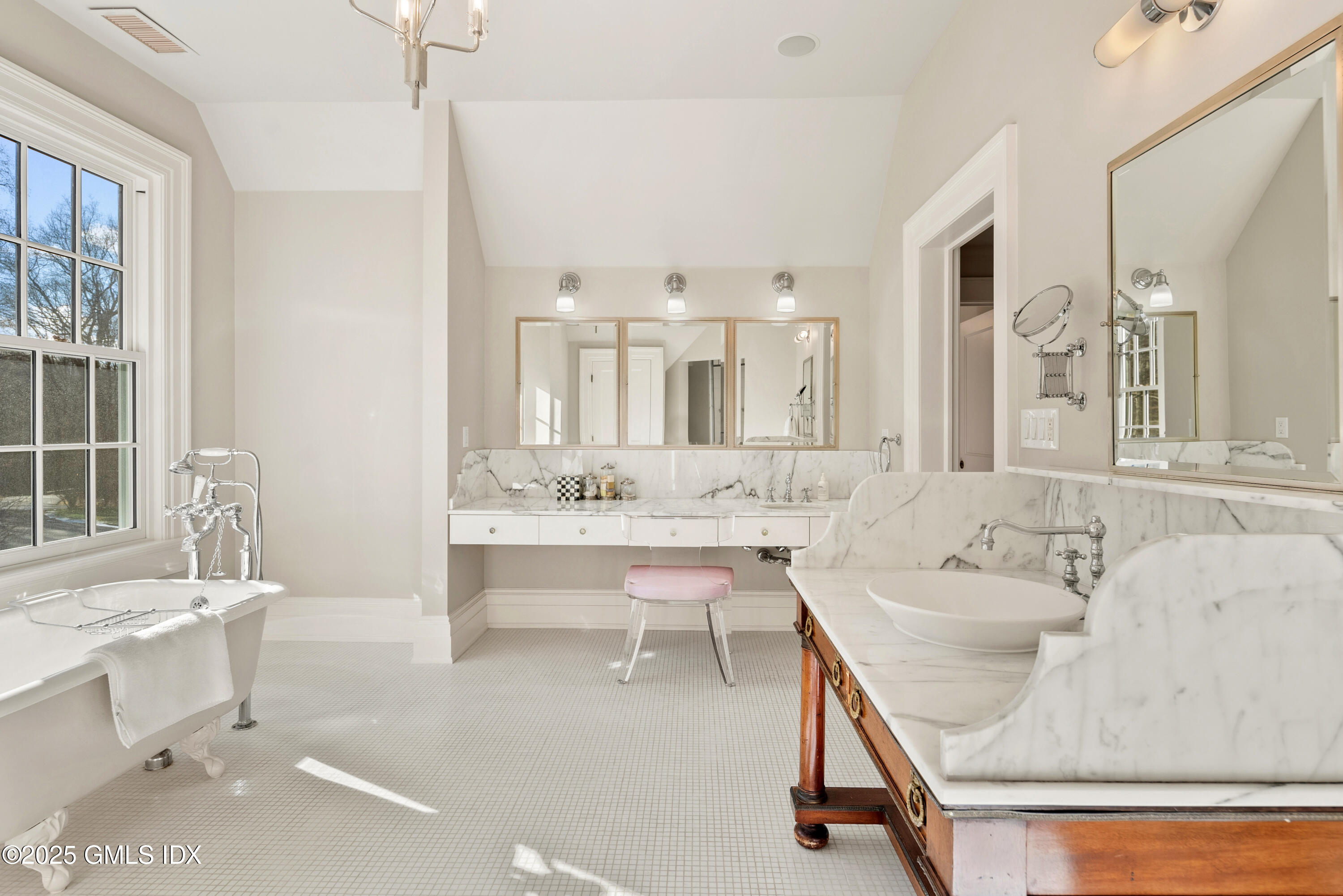 70 Sumner Road Greenwich, CT 06831 - Photo 32 of 57 a bathroom with a sink double vanity mirror and a bathtub