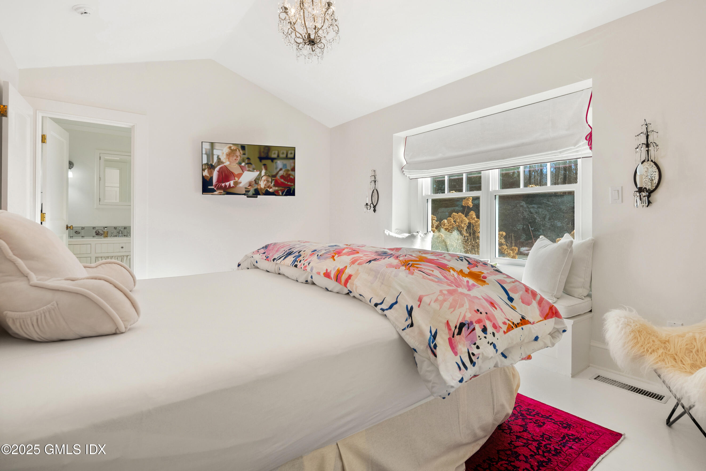 70 Sumner Road Greenwich, CT 06831 - Photo 42 of 57 a bedroom with a bed and window