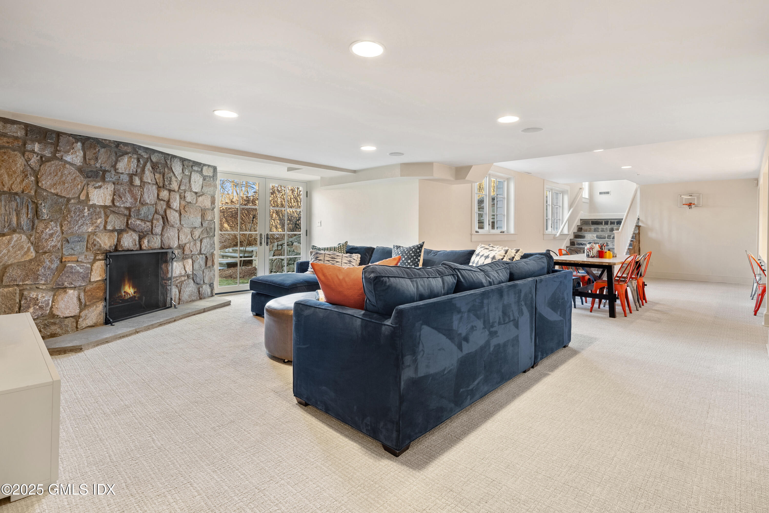 70 Sumner Road Greenwich, CT 06831 - Photo 50 of 57 a living room with furniture and a fireplace