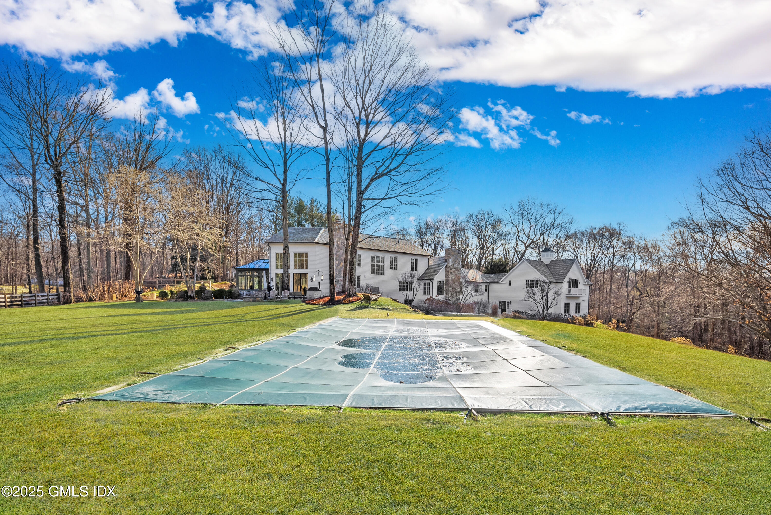 70 Sumner Road Greenwich, CT 06831 - Photo 5 of 57 a view of yard with swimming pool and green space