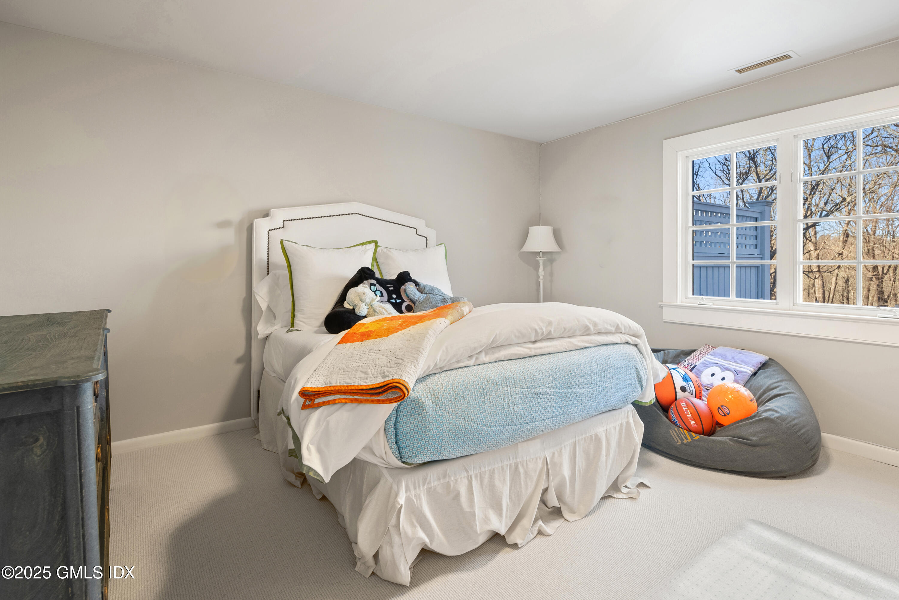 70 Sumner Road Greenwich, CT 06831 - Photo 52 of 57 a bedroom with a bed and a window