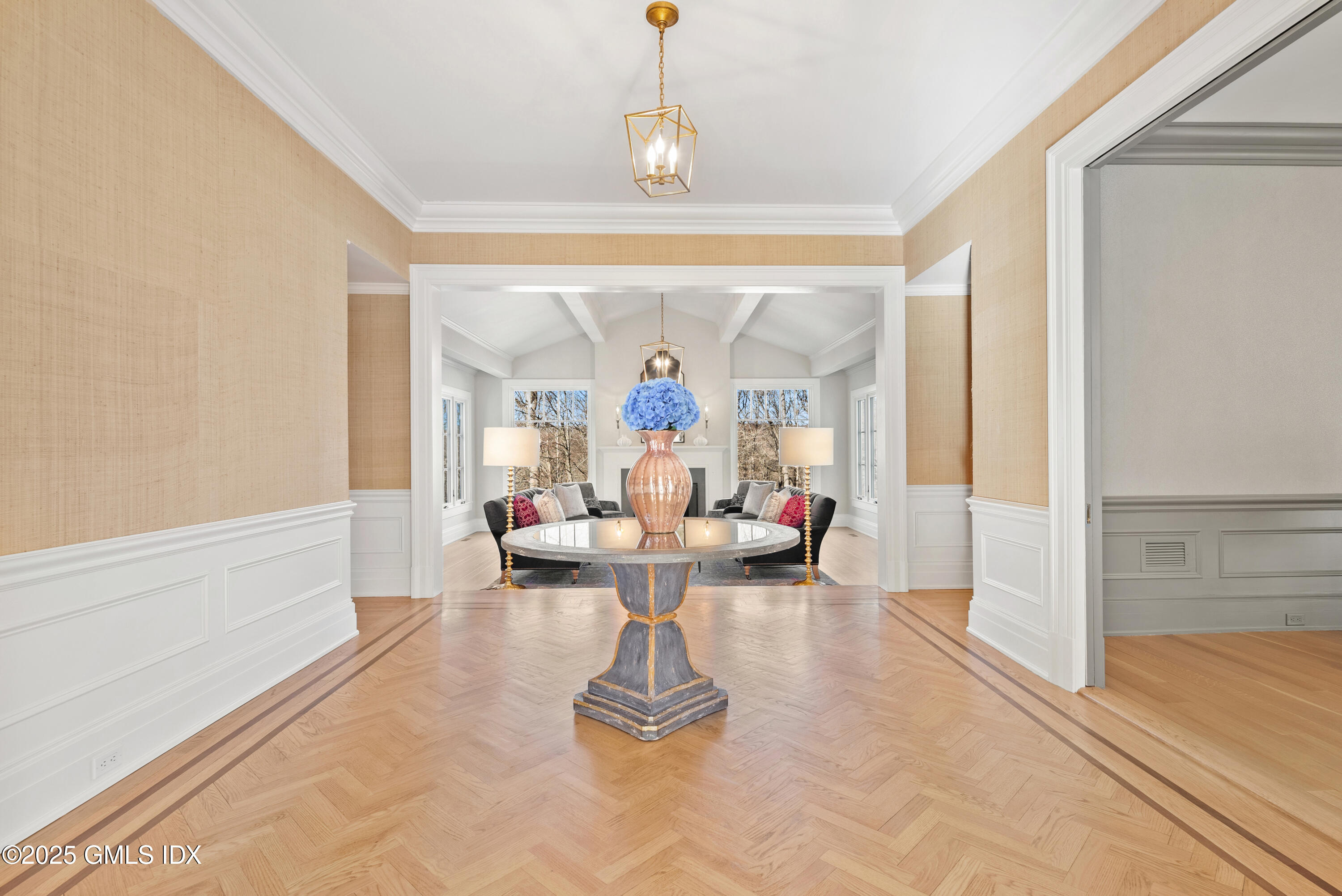 70 Sumner Road Greenwich, CT 06831 - Photo 8 of 57 a living room with furniture and a chandelier
