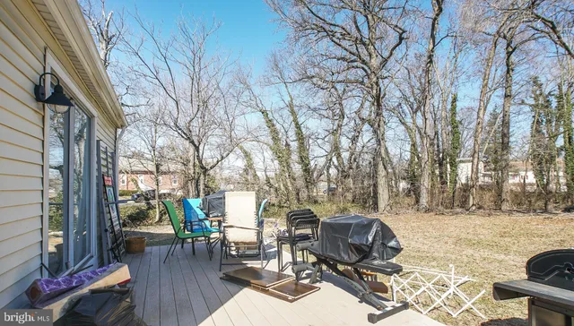 a view of a patio with iron fence