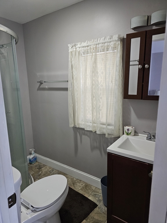 30 Donlon Street Framingham, MA 01701 - Photo 12 of 17 a bathroom with a sink a toilet and shower
