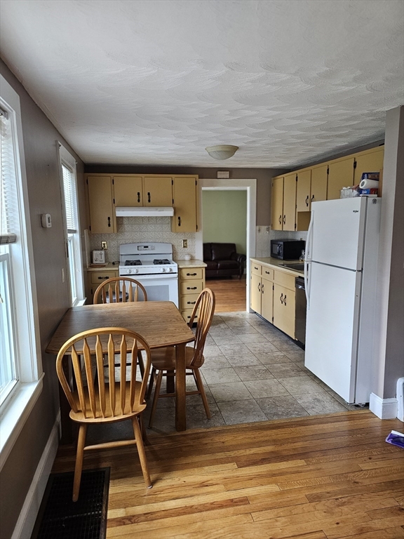 30 Donlon Street Framingham, MA 01701 - Photo 5 of 17 a dining room with furniture and wooden floor