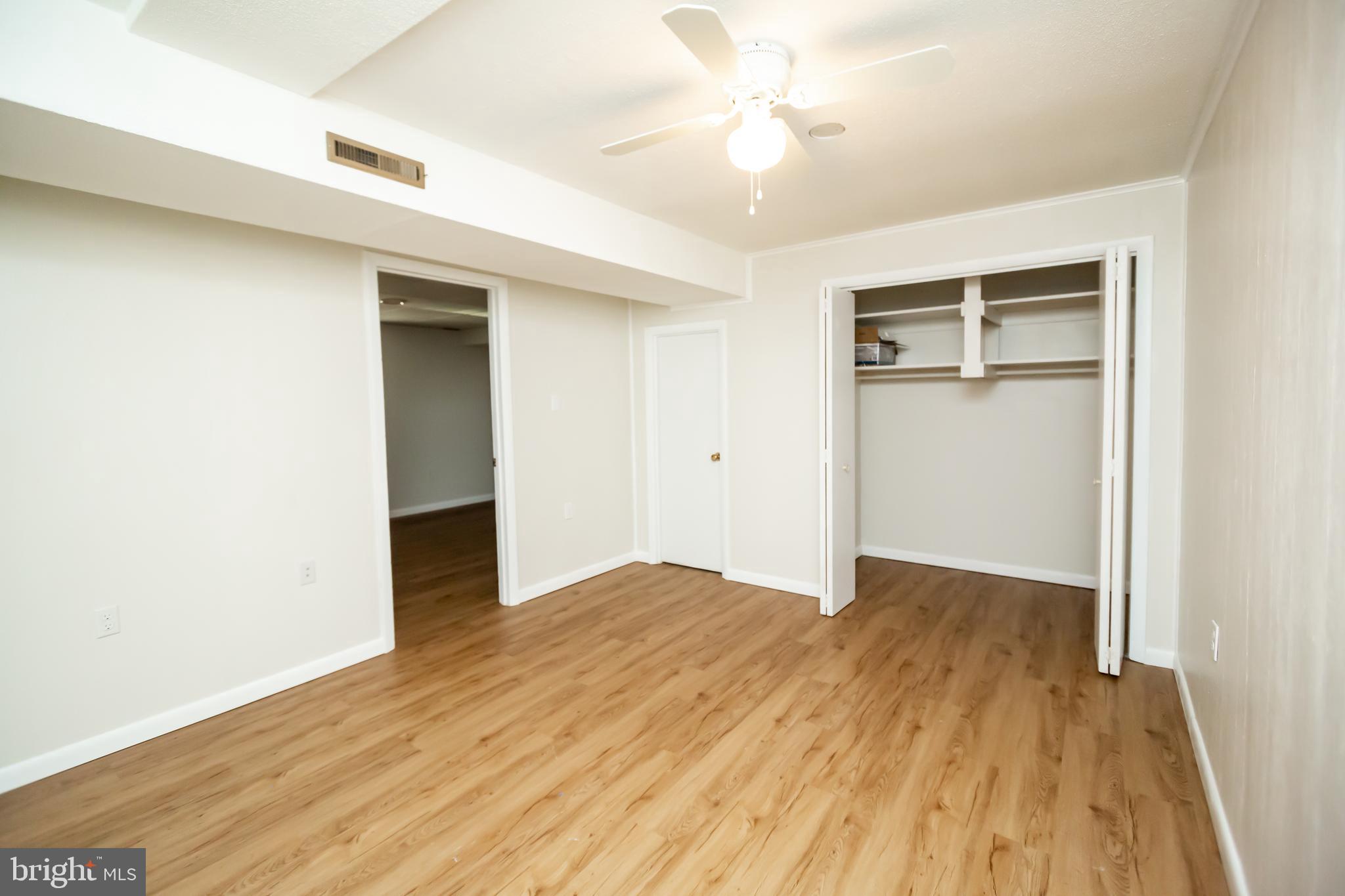 11623 Rivershore Drive Dunkirk, MD 20754 - Photo 37 of 49 an empty room with wooden floor and closet area
