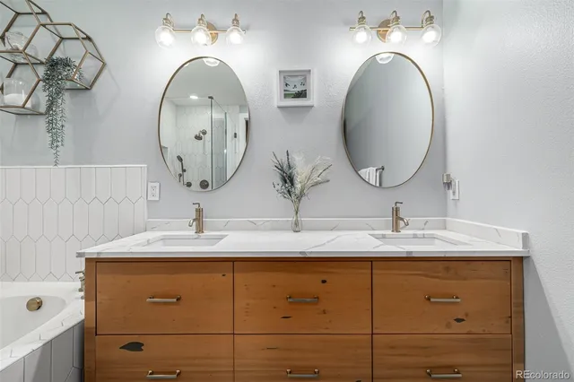 a bathroom with a double vanity sink and a mirror
