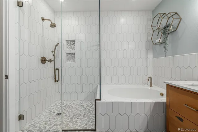 a bathroom with a bathtub and shower