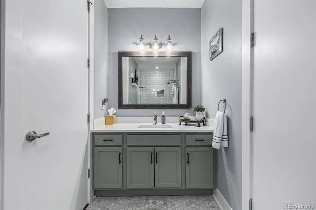 a bathroom with a sink and a mirror