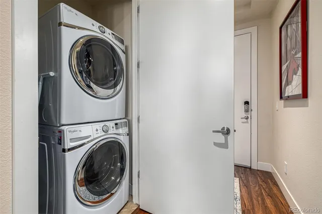 a view of a hallway with washer and dryer