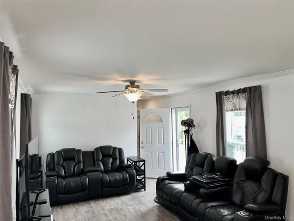 a living room with furniture and a window