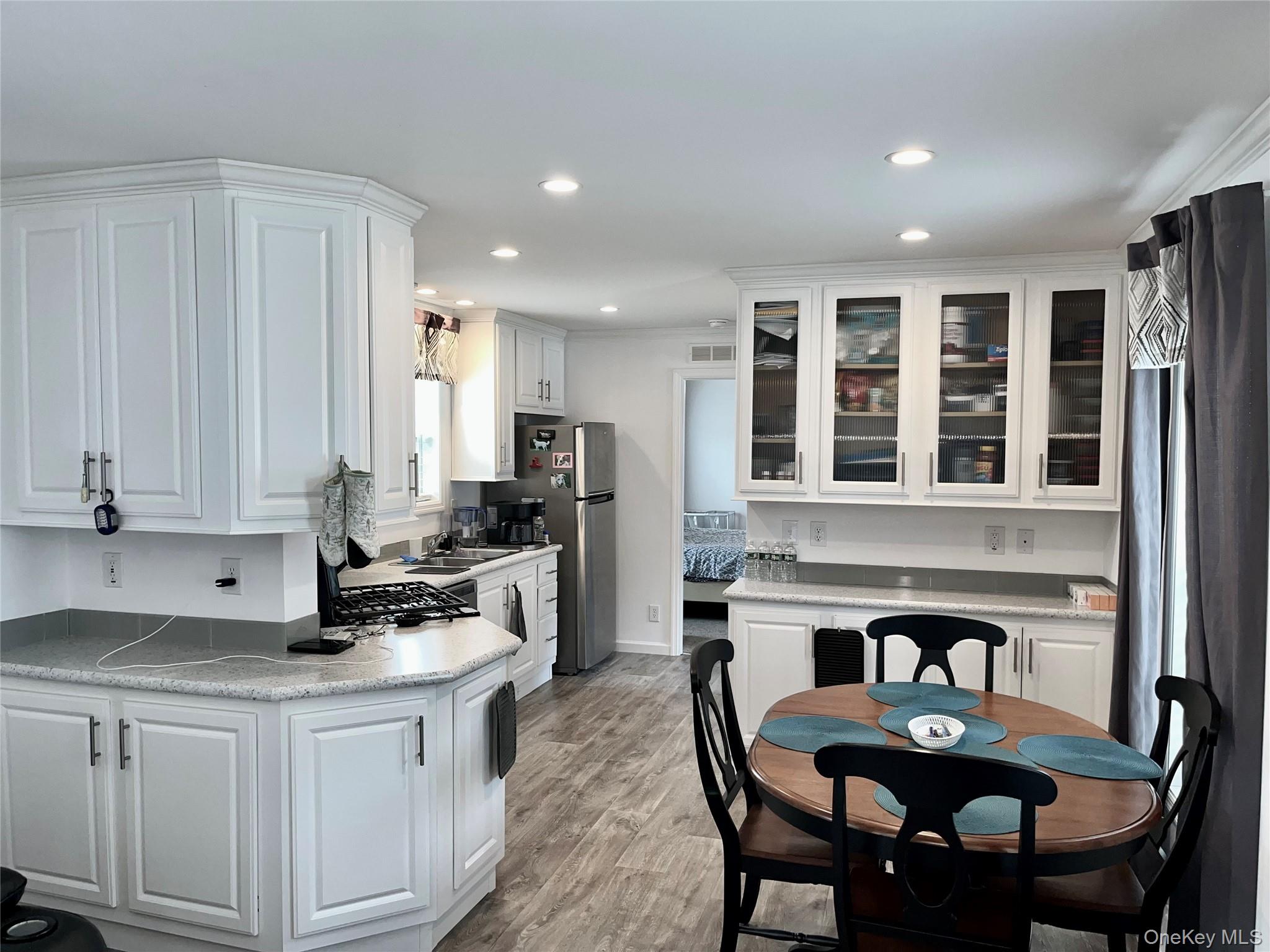 509 5th Avenue Middletown, NY 10941 - Photo 5 of 19 a kitchen with a dining table chairs and refrigerator