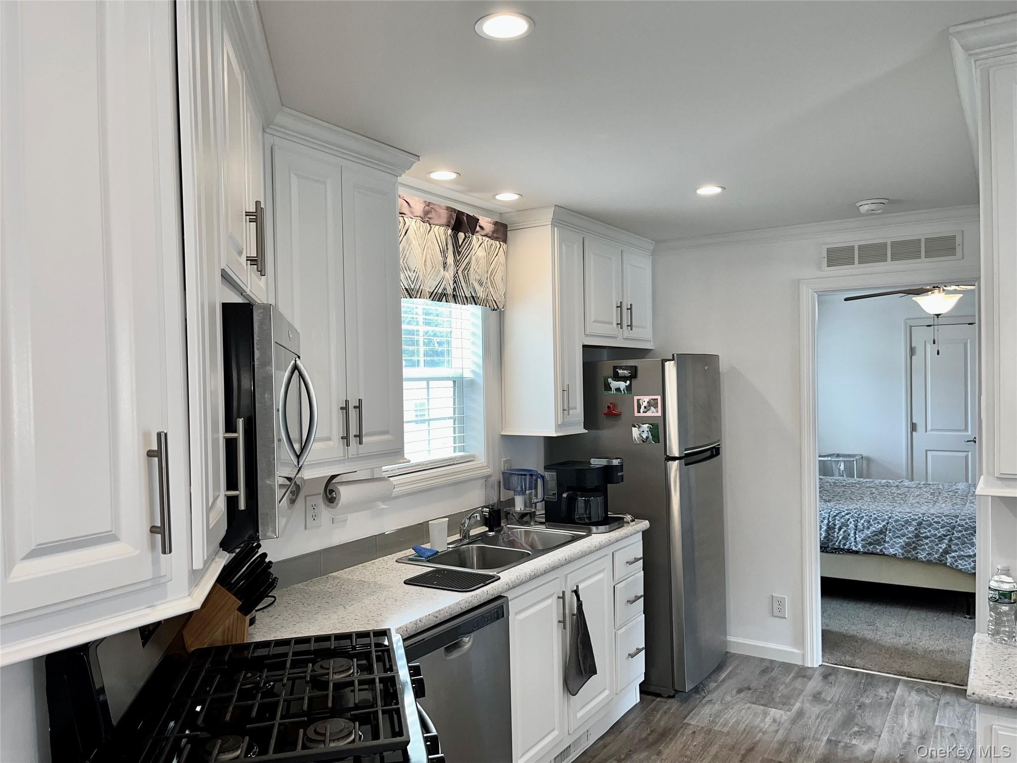 509 5th Avenue Middletown, NY 10941 - Photo 6 of 19 a kitchen with stainless steel appliances a stove a sink and a refrigerator