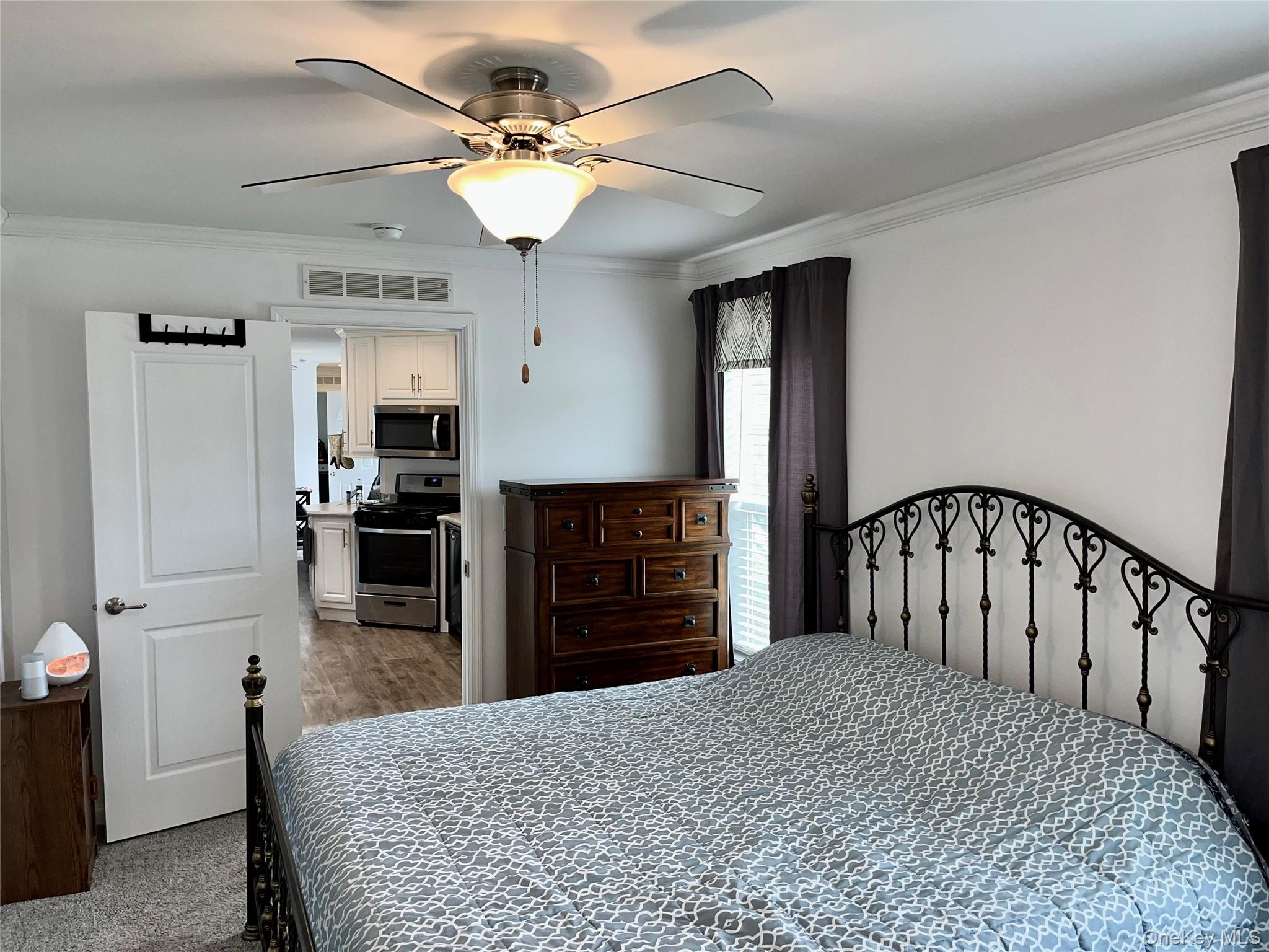 509 5th Avenue Middletown, NY 10941 - Photo 8 of 19 a large kitchen with cabinets wooden floor and stainless steel appliances