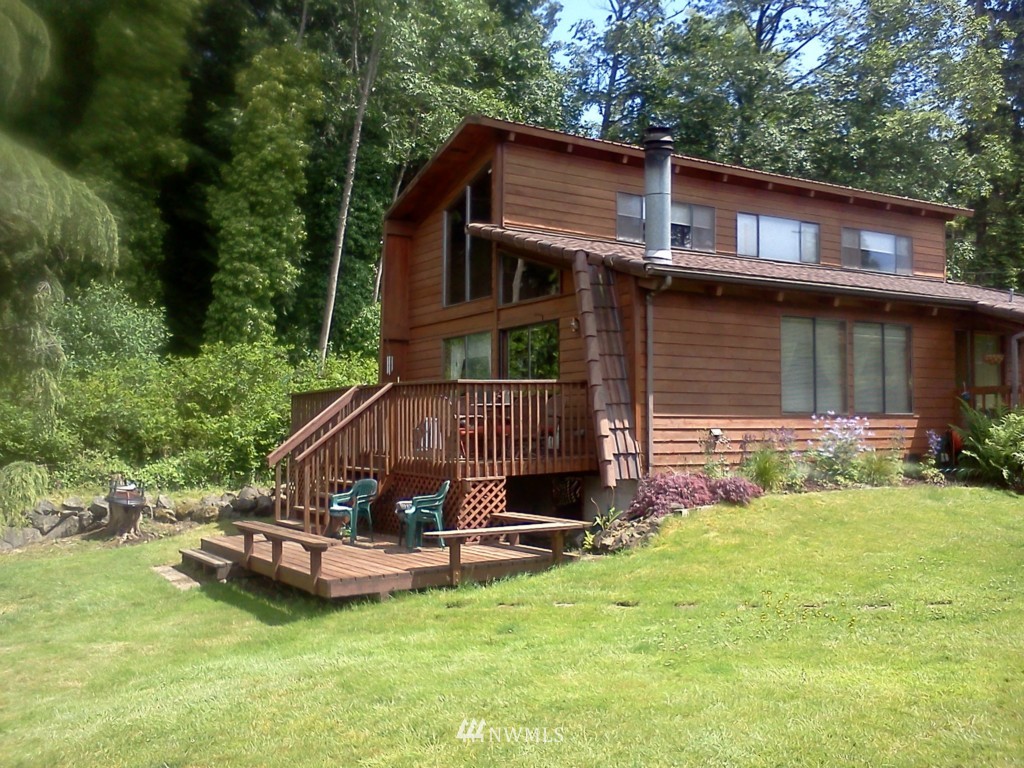 118 Southwest 293rd Street Federal Way, WA 98023 - Photo 1 of 1 a view of a house with a yard patio and a wooden deck