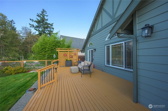 an aerial view of a house with garden space and street view