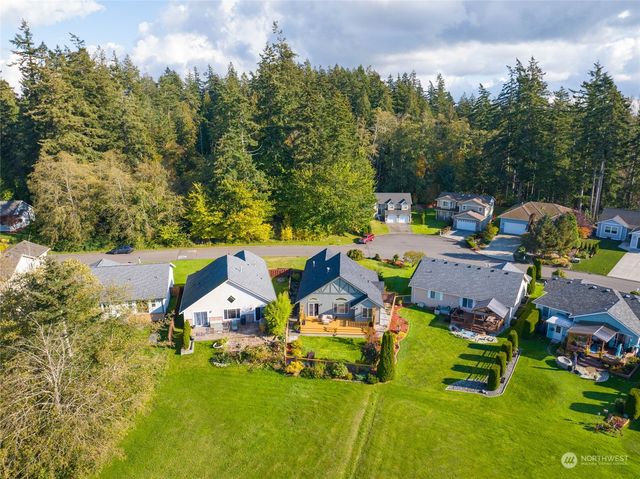 an aerial view of a houses with swimming pool