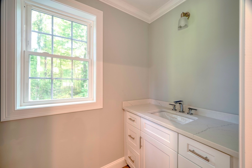 21 Valley Road Holbrook, MA 02343 - Photo 12 of 19 a bathroom with a granite countertop sink a mirror and a window