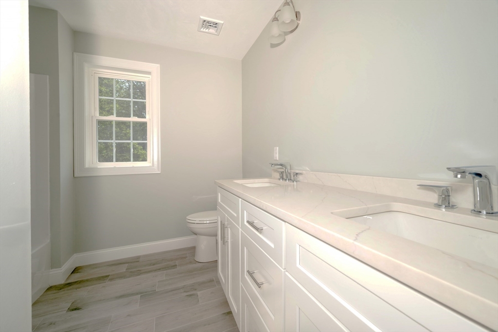 21 Valley Road Holbrook, MA 02343 - Photo 14 of 19 a bathroom with a sink and a toilet
