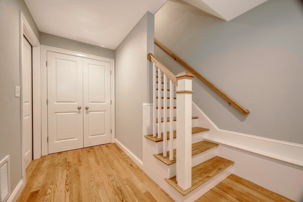 21 Valley Road Holbrook, MA 02343 - Photo 18 of 19 a view of entryway with wooden floor and stairs