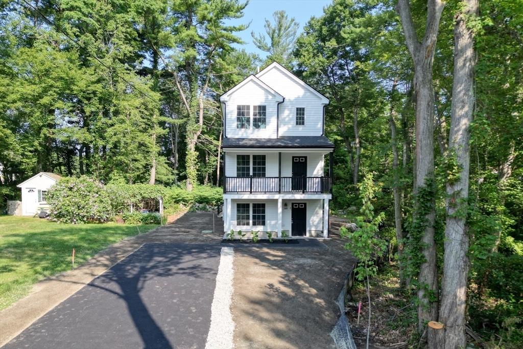 21 Valley Road Holbrook, MA 02343 - Photo 2 of 19 a front view of a house with a garden