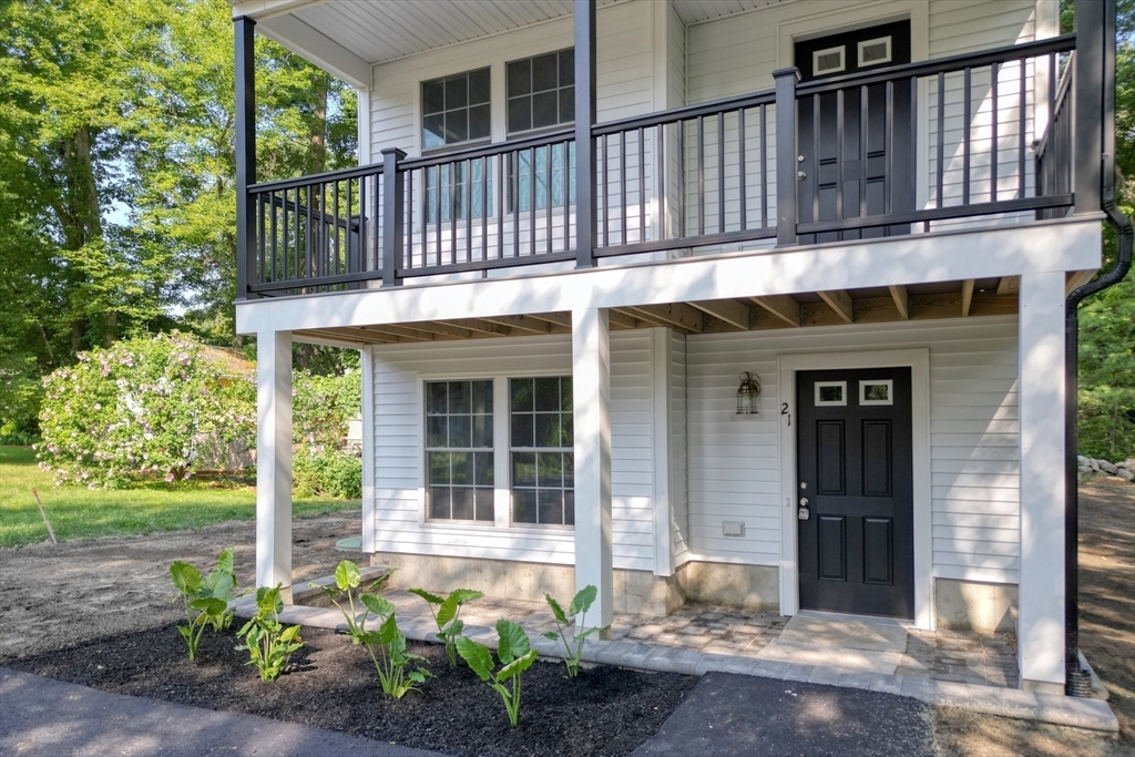 21 Valley Road Holbrook, MA 02343 - Photo 3 of 19 a front view of a house with a garden