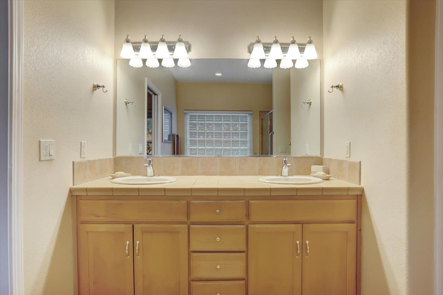 17036 Alice Way Grass Valley, CA 95949 - Photo 39 of 58 a bathroom with a sink and a mirror