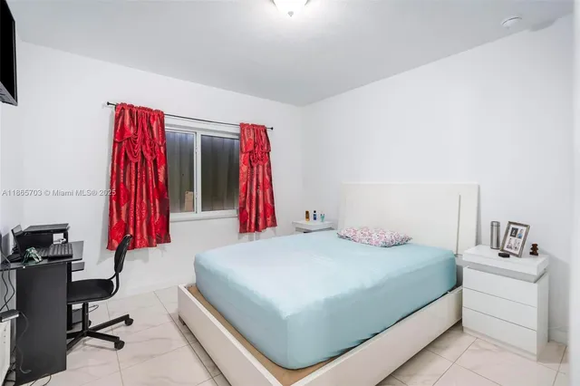 a bedroom with a bed and a closet