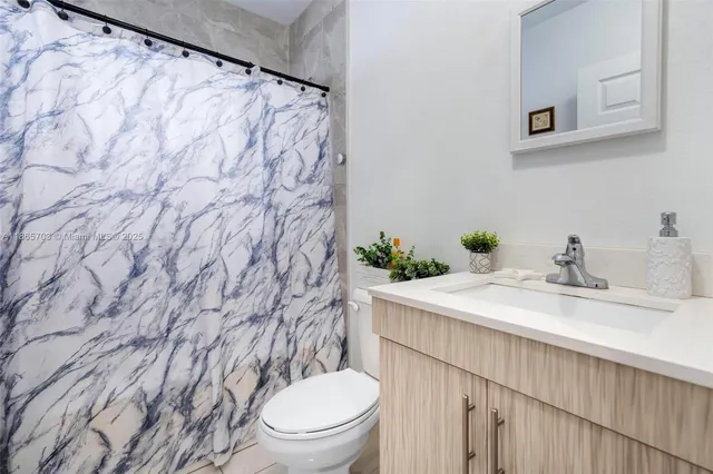 a bathroom with a sink and a toilet
