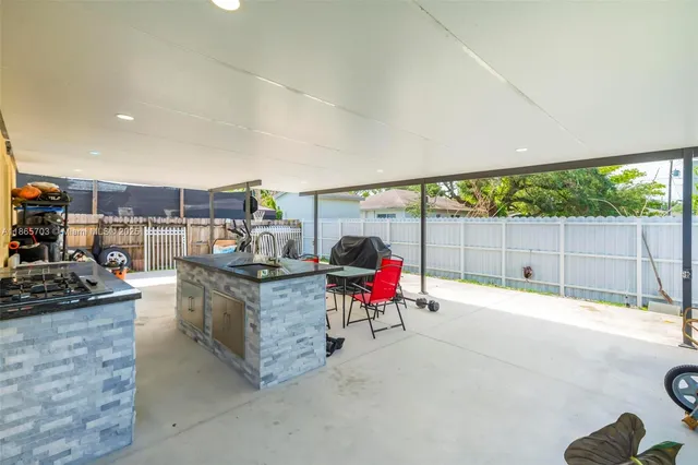 an aerial view of residential houses with outdoor space and street view