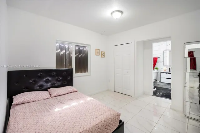 a bedroom with a bed and a cabinets