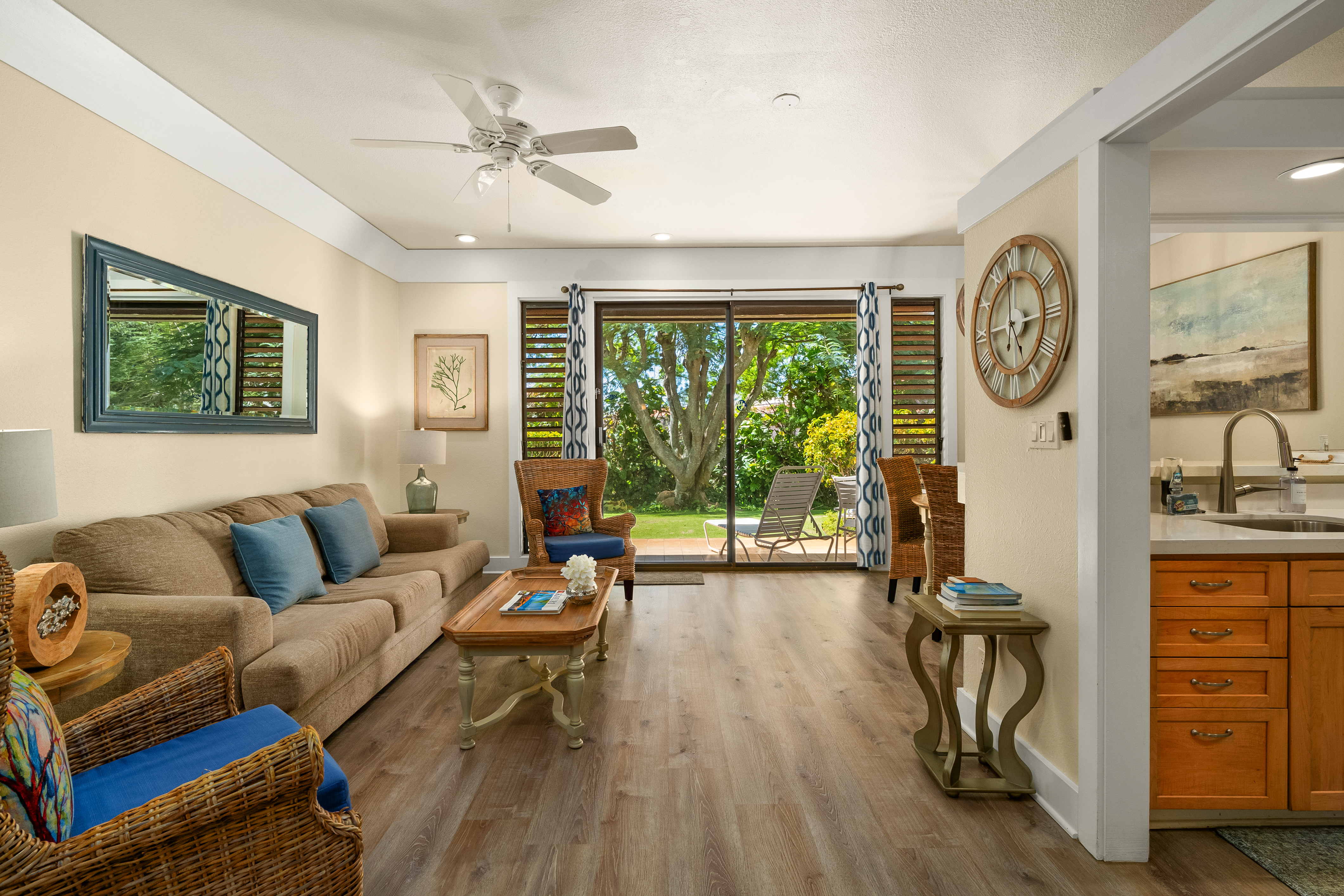 2253 Poipu Road, Unit 402 Koloa, HI 96756 - Photo 1 of 16 a living room with furniture and a large window