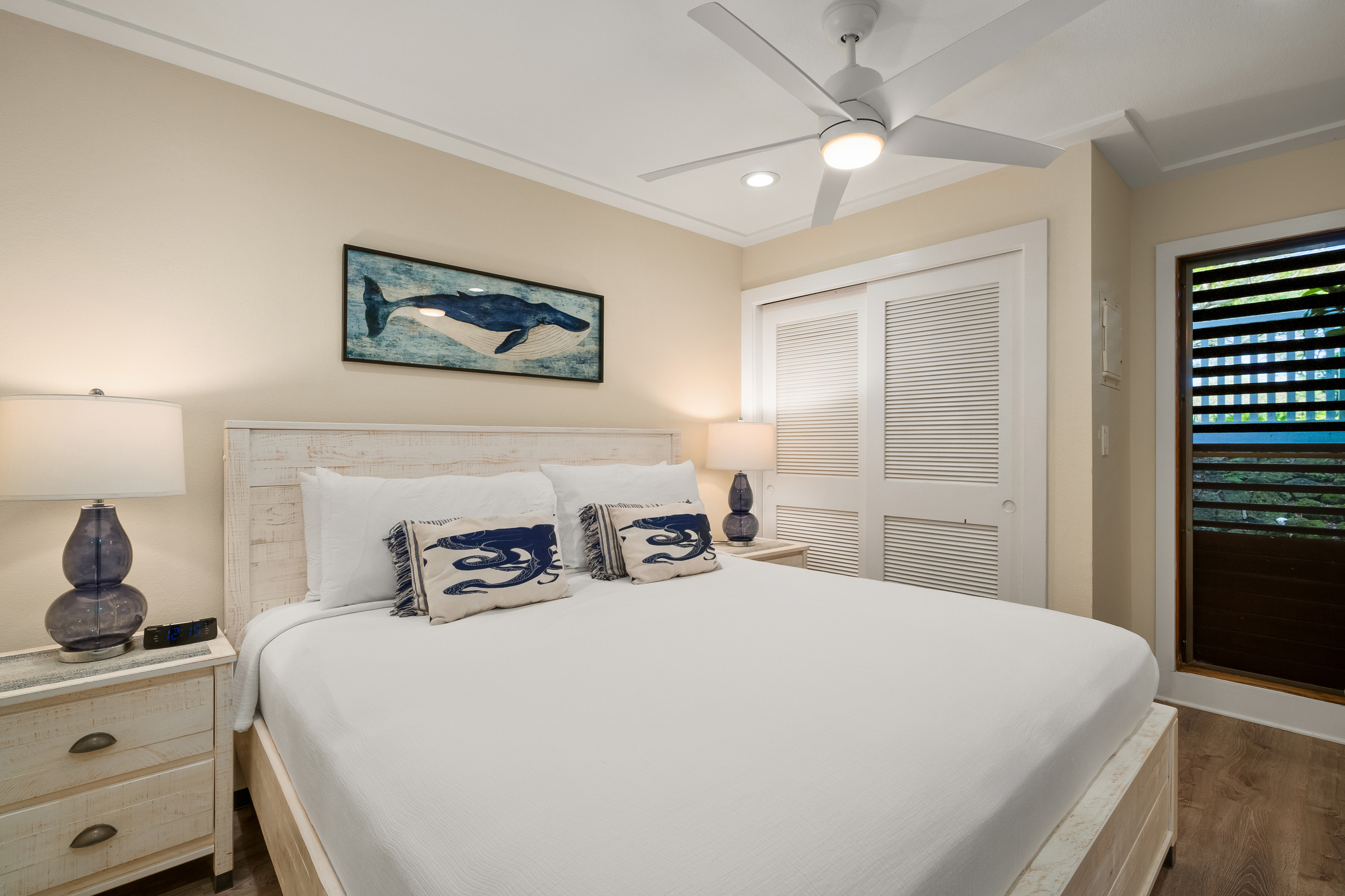 2253 Poipu Road, Unit 402 Koloa, HI 96756 - Photo 11 of 16 a bedroom with a bed and a tv