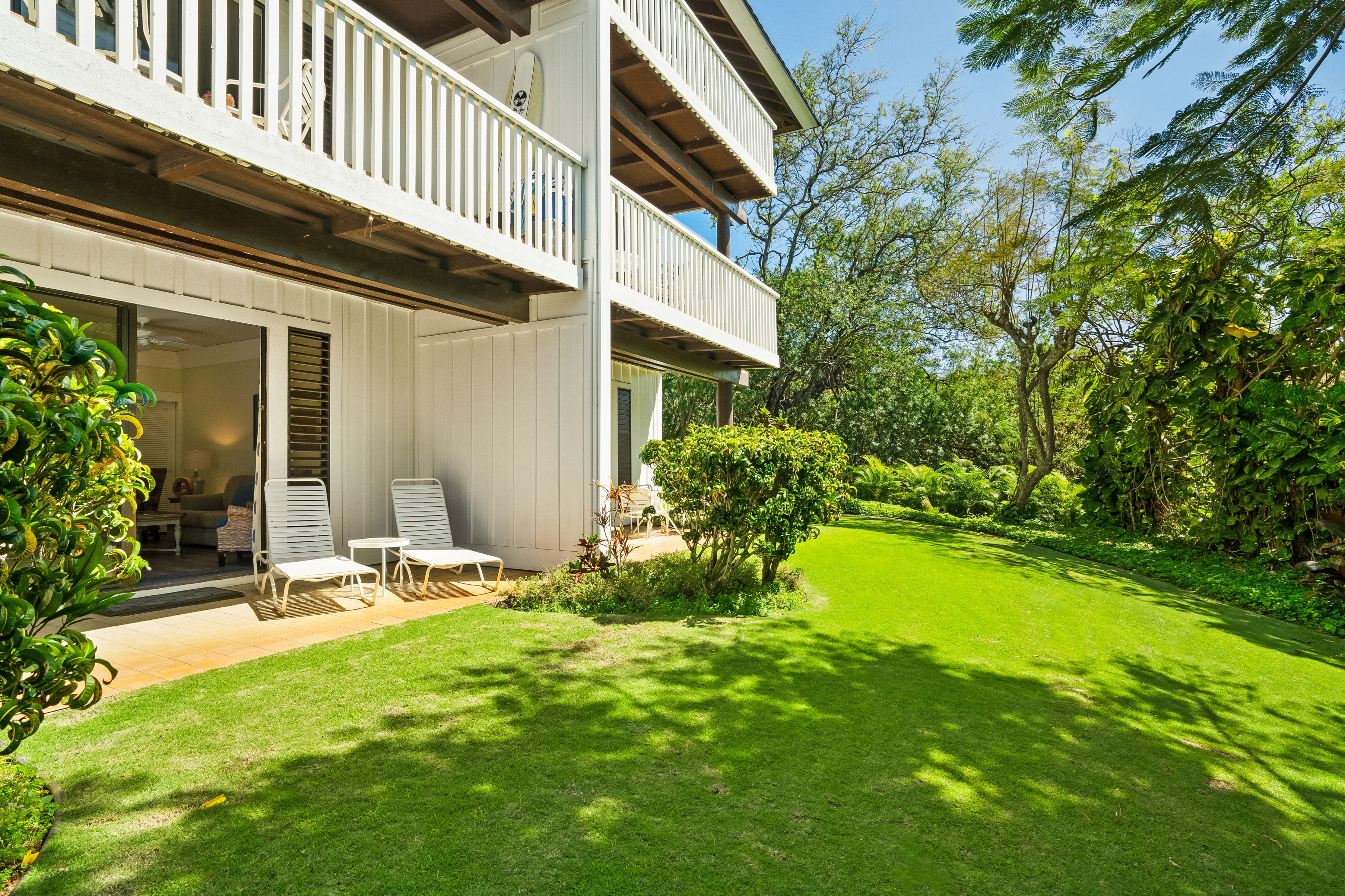 2253 Poipu Road, Unit 402 Koloa, HI 96756 - Photo 16 of 16 a view of a house with backyard and sitting area