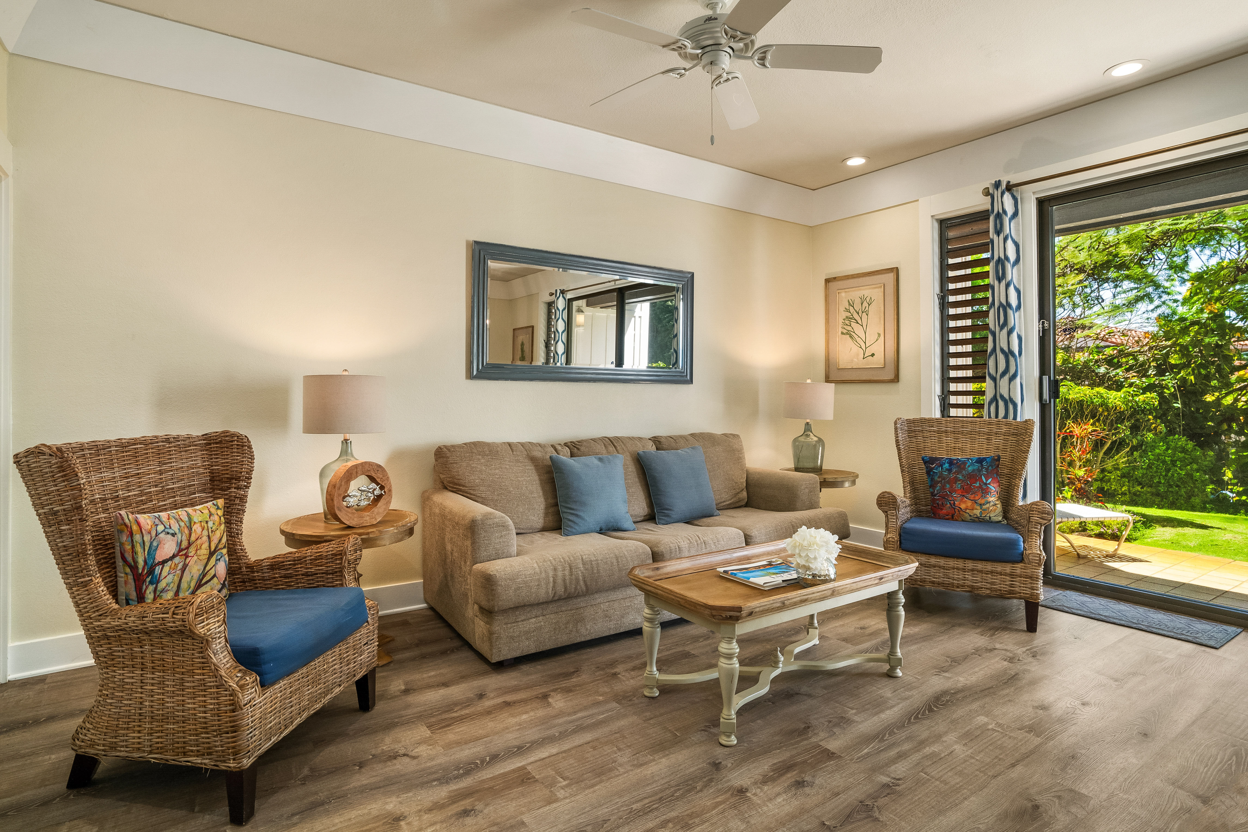 2253 Poipu Road, Unit 402 Koloa, HI 96756 - Photo 2 of 16 a living room with furniture and a large window