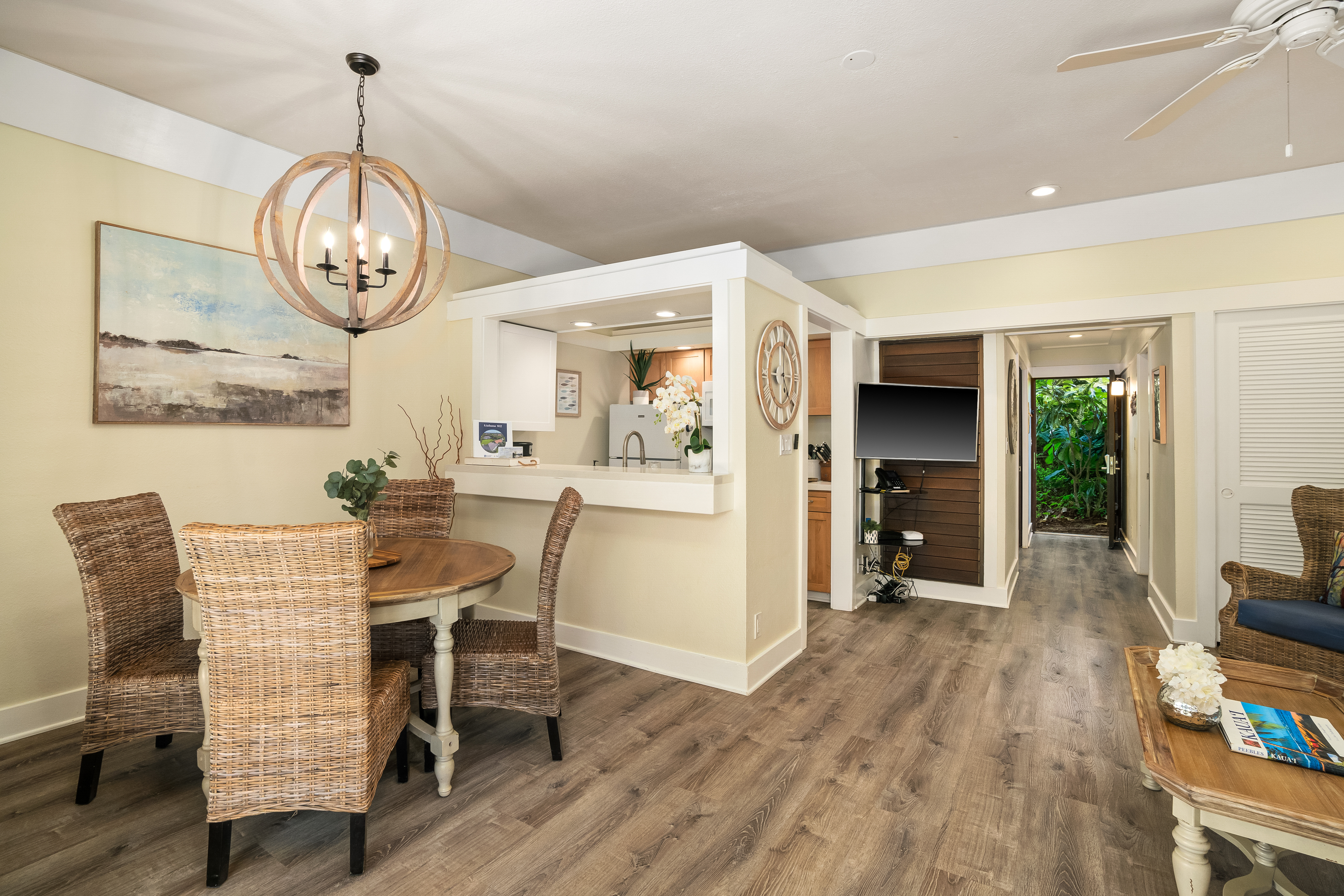 2253 Poipu Road, Unit 402 Koloa, HI 96756 - Photo 5 of 16 a view of a dining room with furniture window and wooden floor