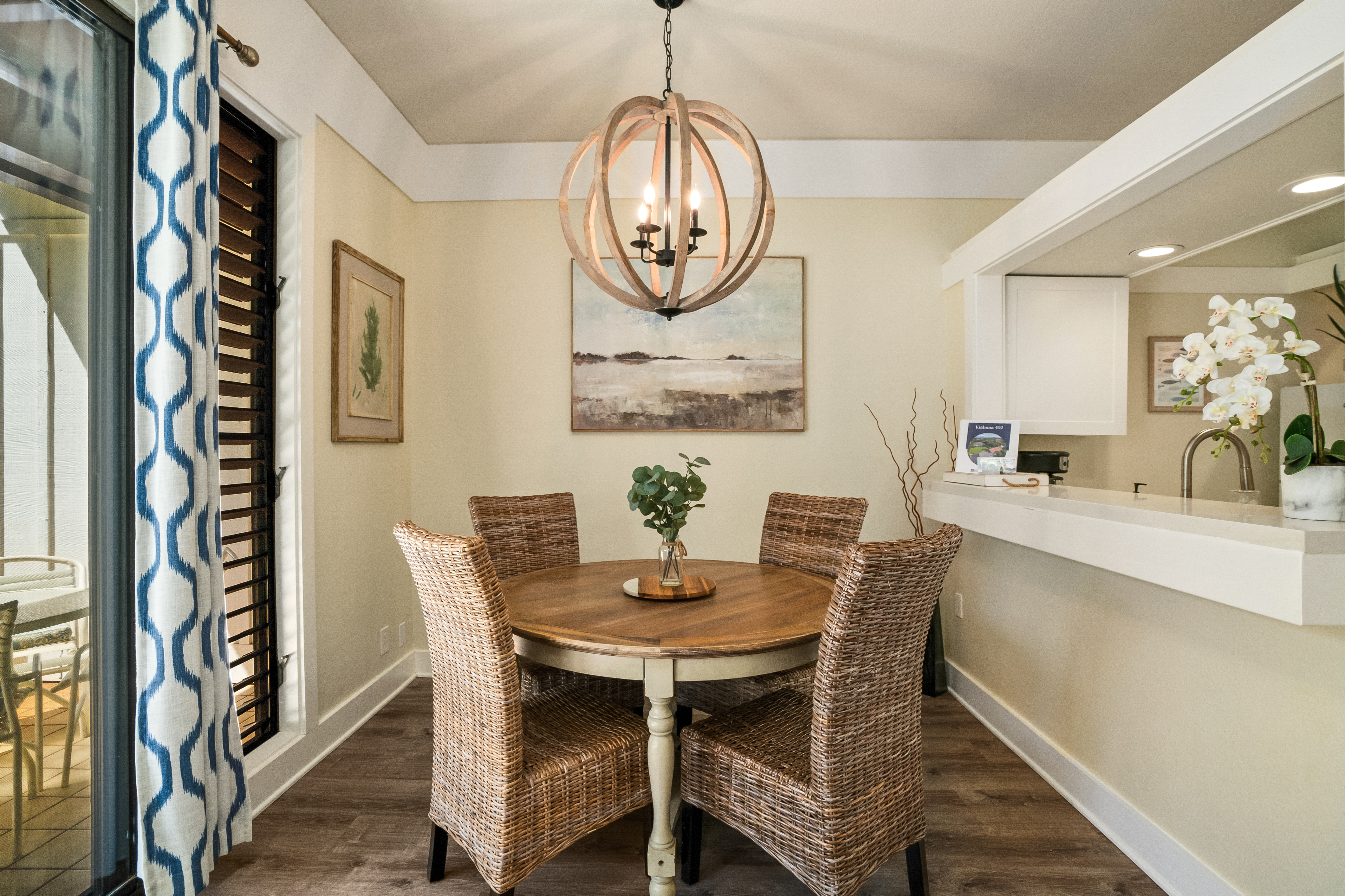 2253 Poipu Road, Unit 402 Koloa, HI 96756 - Photo 8 of 16 a view of a dining room with furniture and wooden floor