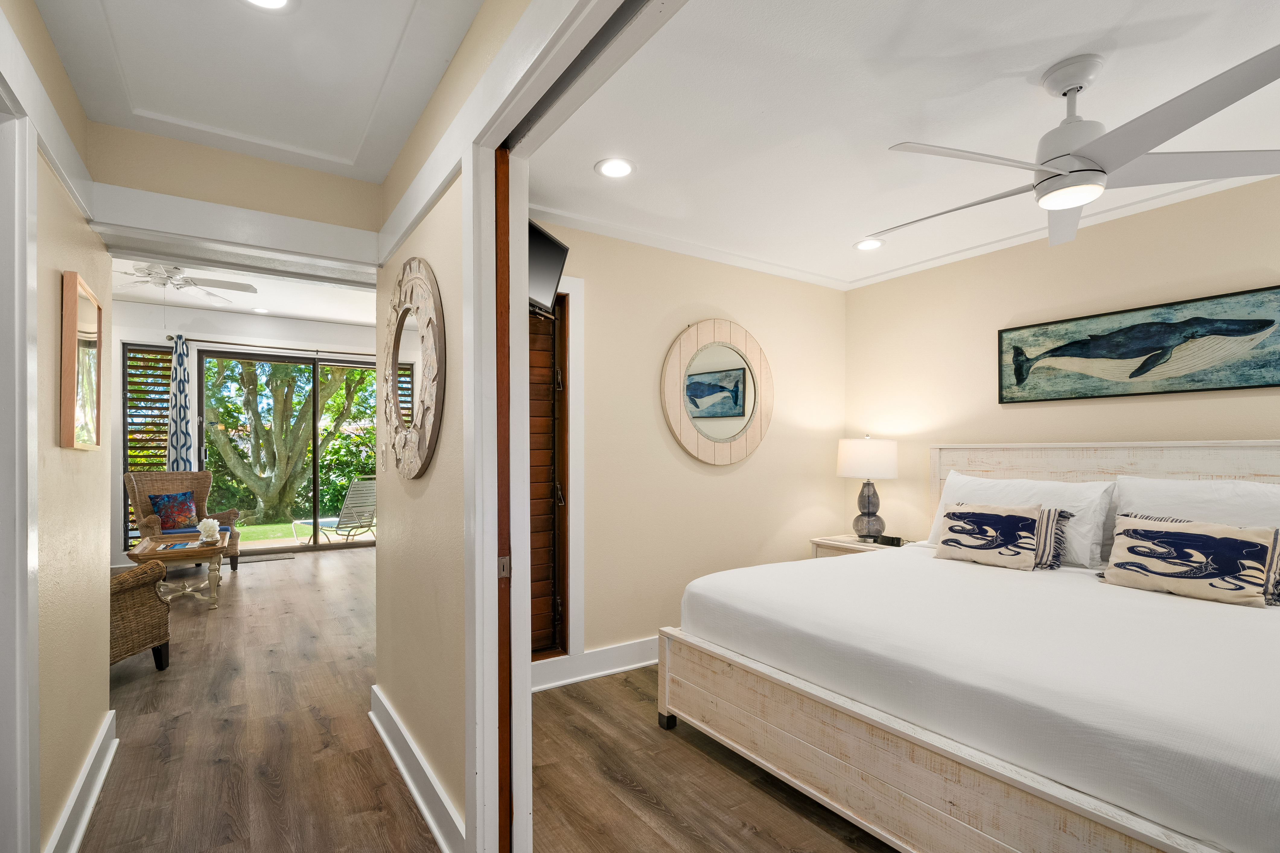 2253 Poipu Road, Unit 402 Koloa, HI 96756 - Photo 10 of 16 a bedroom with a bed and a large mirror