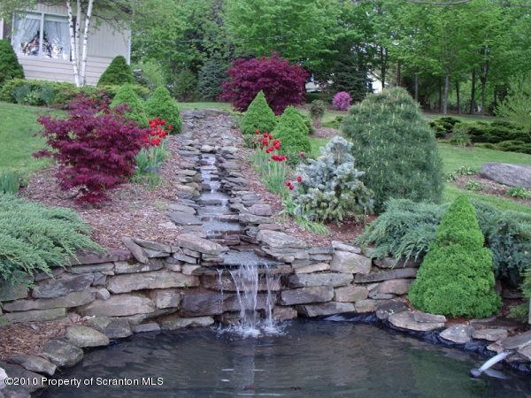 156 Mid Valley Road Lake Ariel, PA 18436 - Photo 4 of 24 a view of a garden with flowers