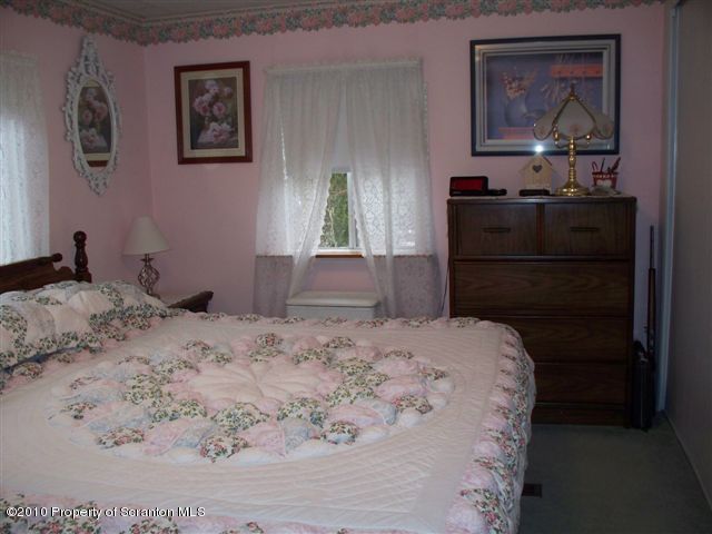 156 Mid Valley Road Lake Ariel, PA 18436 - Photo 8 of 24 a bedroom with a bed and a dresser