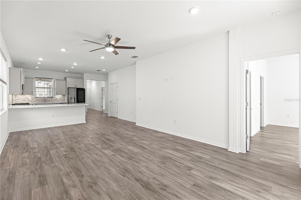10242 Southwest 99th Lane Ocala, FL 34481 - Photo 22 of 51 a view of a kitchen with wooden floor and a kitchen space