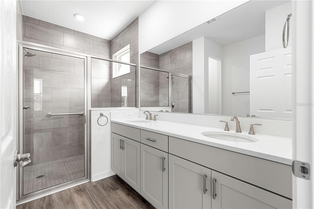 10242 Southwest 99th Lane Ocala, FL 34481 - Photo 28 of 51 a bathroom with a shower sink and mirror