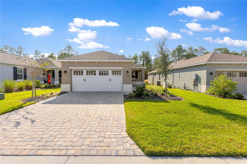10242 Southwest 99th Lane Ocala, FL 34481 - Photo 3 of 51 a view of a house with a patio