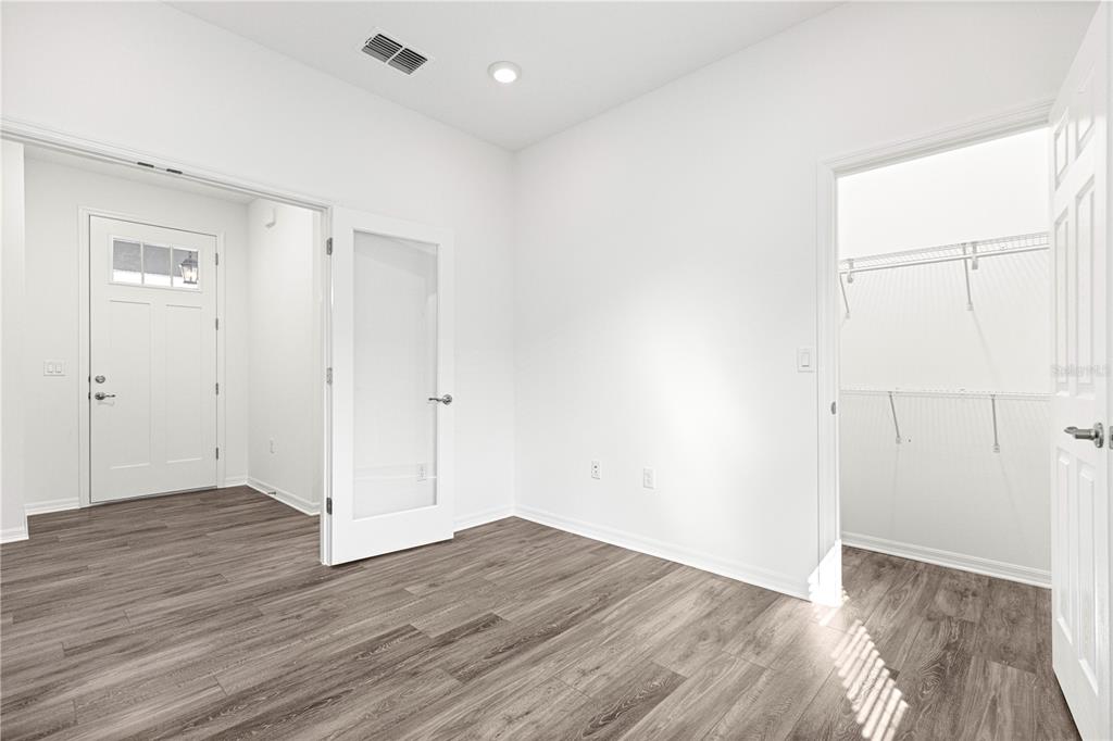 10242 Southwest 99th Lane Ocala, FL 34481 - Photo 38 of 51 an empty room with wooden floor