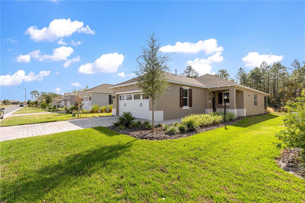 10242 Southwest 99th Lane Ocala, FL 34481 - Photo 4 of 51 a front view of house with yard and green space